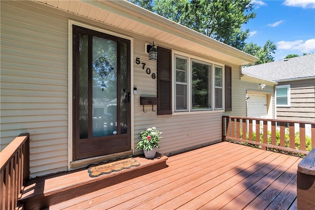 5706 Beverly Ave, Mission, KS 66202 - wooden deck featuring an attached garage