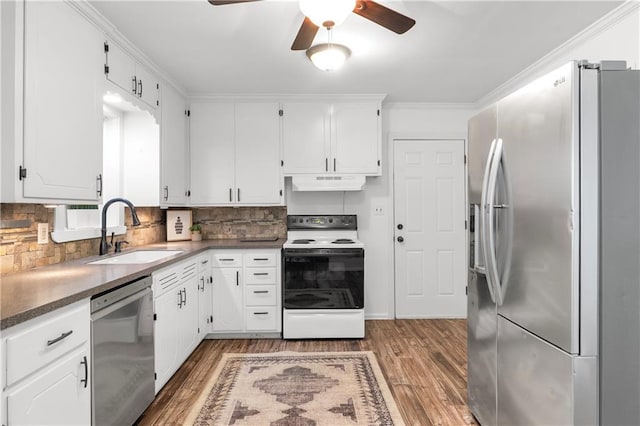 5706 Beverly Ave, Mission, KS 66202 - kitchen featuring appliances with stainless steel finishes, under cabinet range hood, light wood finished floors, ceiling fan, and ornamental molding