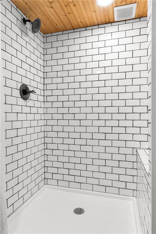 5706 Beverly Ave, Mission, KS 66202 - bathroom with wood ceiling and tiled shower