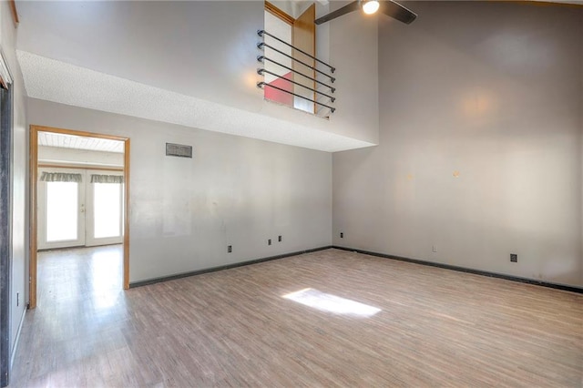 18120 E 25th Ter, Independence, MO 64057 - spare room featuring wood finished floors, ceiling fan, and french doors