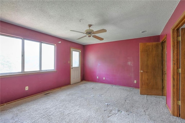 18120 E 25th Ter, Independence, MO 64057 - unfurnished bedroom featuring carpet floors, a textured ceiling, and a ceiling fan