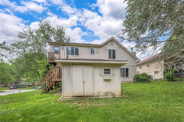 18120 E 25th Ter, Independence, MO 64057 - rear view of house featuring stairs and a storage unit