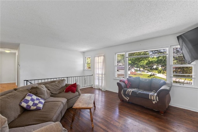 2206 N 73rd Ter, Kansas City, KS 66109 - living room featuring a textured ceiling and wood finished floors