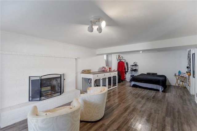 2206 N 73rd Ter, Kansas City, KS 66109 - living room with wood finished floors, a fireplace, and ornamental molding