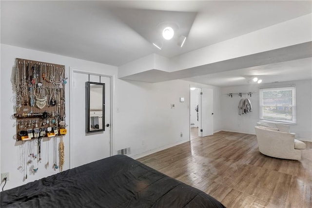2206 N 73rd Ter, Kansas City, KS 66109 - living room featuring wood finished floors and baseboards