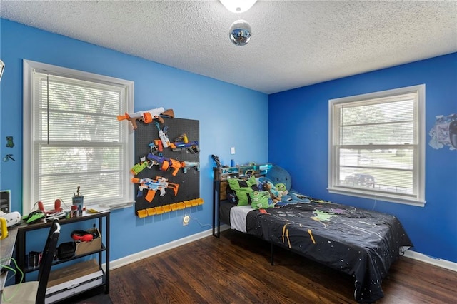 2206 N 73rd Ter, Kansas City, KS 66109 - bedroom with wood finished floors and a textured ceiling