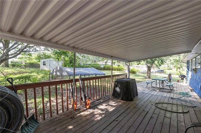 2206 N 73rd Ter, Kansas City, KS 66109 - wooden terrace with grilling area and outdoor dining space