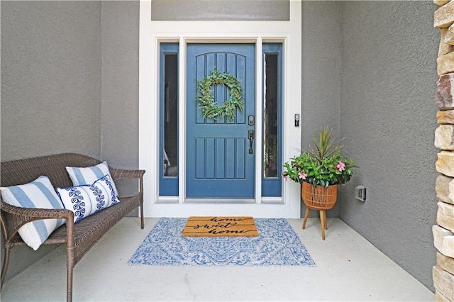 1216 Hillmann Ln, Warrensburg, MO 64093 - entrance to property featuring stucco siding