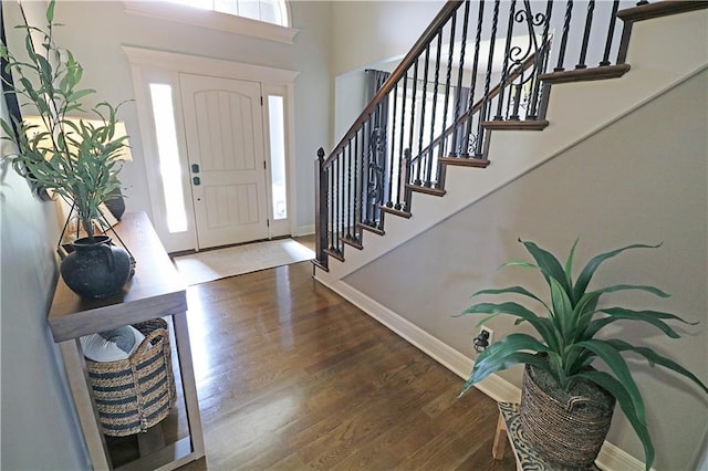 1216 Hillmann Ln, Warrensburg, MO 64093 - entrance foyer featuring wood finished floors, stairs, and a towering ceiling