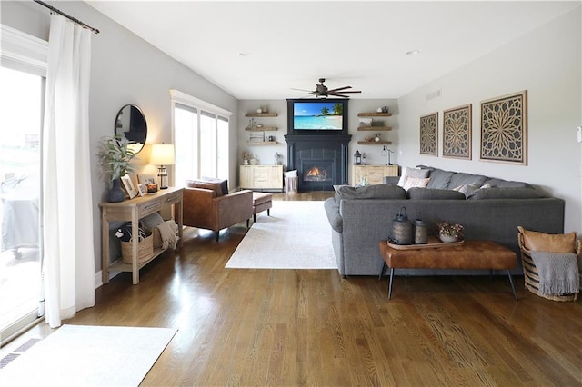 1216 Hillmann Ln, Warrensburg, MO 64093 - living area featuring a ceiling fan, a lit fireplace, and wood finished floors