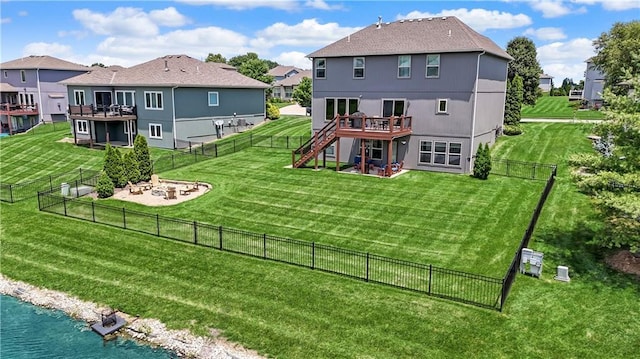 1216 Hillmann Ln, Warrensburg, MO 64093 - rear view of property featuring a wooden deck, stairway, an outdoor fire pit, a fenced backyard, and a residential view