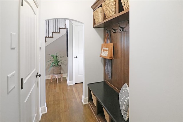1216 Hillmann Ln, Warrensburg, MO 64093 - mudroom featuring arched walkways and dark wood finished floors