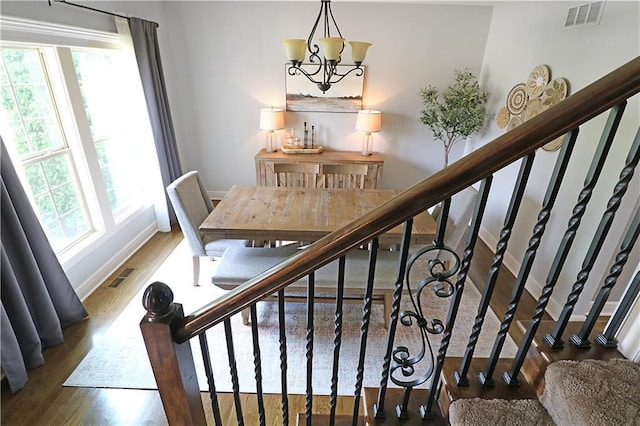 1216 Hillmann Ln, Warrensburg, MO 64093 - stairs with wood finished floors and a chandelier