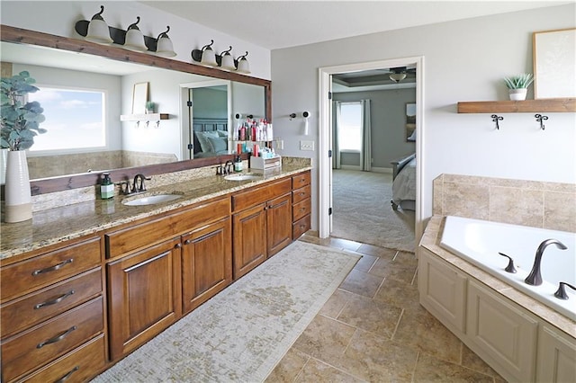 1216 Hillmann Ln, Warrensburg, MO 64093 - ensuite bathroom featuring healthy amount of natural light, a garden tub, vanity, and a spacious closet