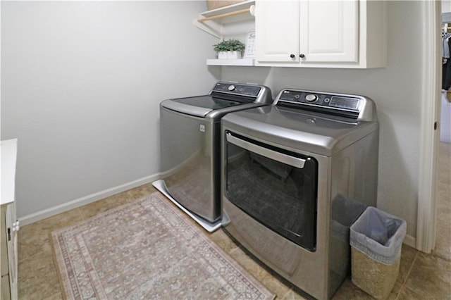1216 Hillmann Ln, Warrensburg, MO 64093 - laundry area featuring cabinet space and washer and dryer