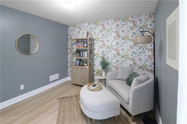 1216 Hillmann Ln, Warrensburg, MO 64093 - sitting room featuring light wood-style flooring and wallpapered walls