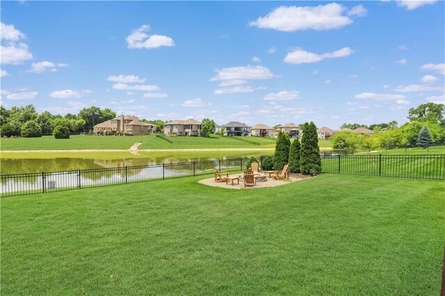 1216 Hillmann Ln, Warrensburg, MO 64093 - view of yard featuring a fire pit, a water view, and a residential view