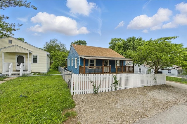 814 S Saville St, Independence, MO 64052 - bungalow-style house featuring covered porch and a fenced front yard