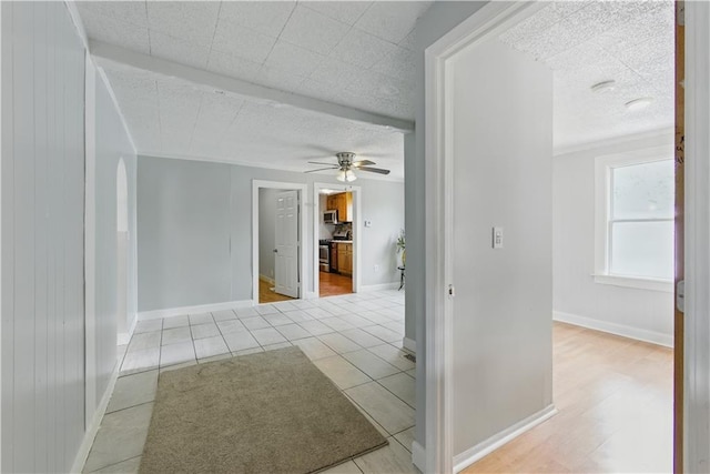 814 S Saville St, Independence, MO 64052 - tiled empty room with a ceiling fan and a textured ceiling