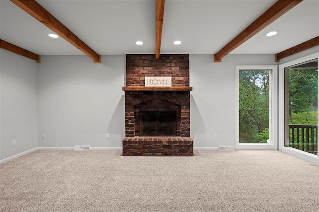 12343 Pinehurst Dr, Kansas City, KS 66109 - unfurnished living room with carpet floors, beam ceiling, a fireplace, and recessed lighting