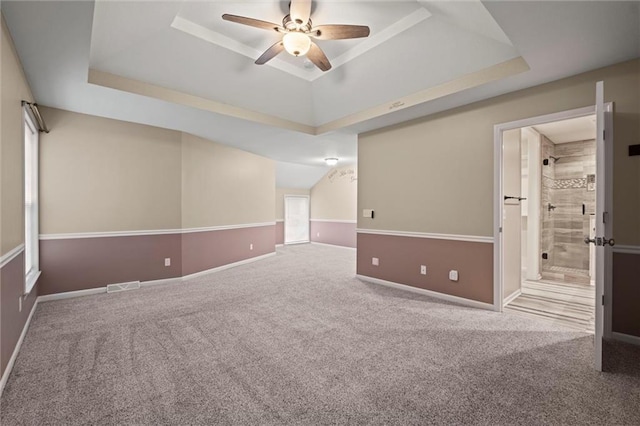 12343 Pinehurst Dr, Kansas City, KS 66109 - carpeted empty room featuring a raised ceiling and ceiling fan
