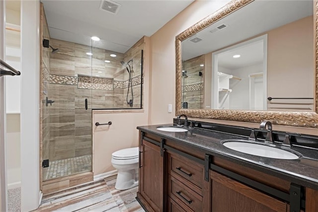 12343 Pinehurst Dr, Kansas City, KS 66109 - full bath with double vanity, a shower stall, and recessed lighting
