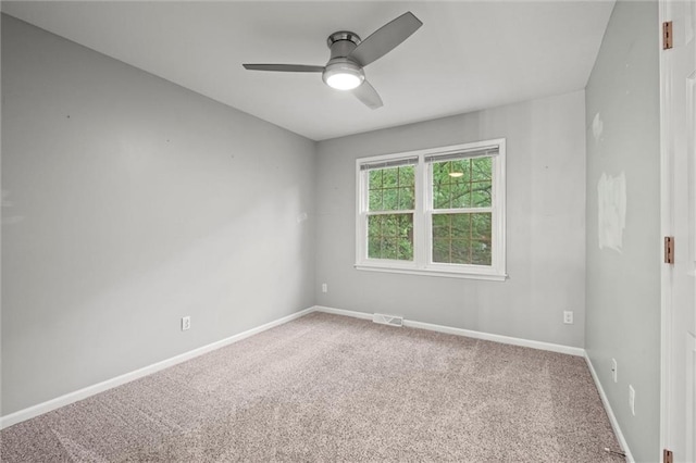 12343 Pinehurst Dr, Kansas City, KS 66109 - spare room featuring carpet floors and a ceiling fan