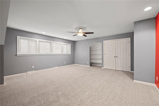 12343 Pinehurst Dr, Kansas City, KS 66109 - unfurnished bedroom featuring two closets, carpet, ceiling fan, and recessed lighting