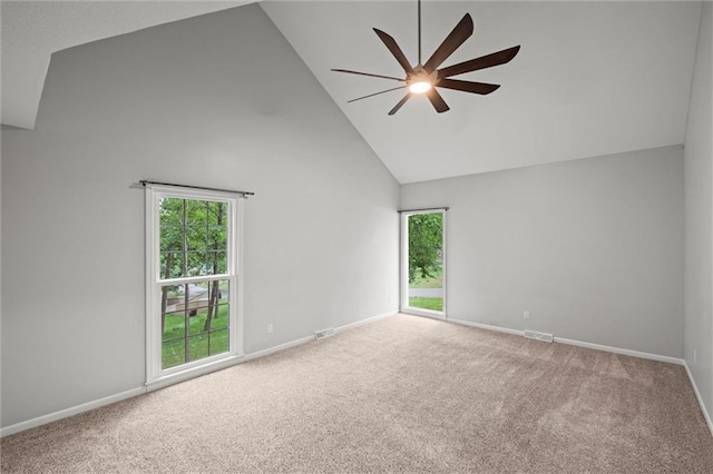 12343 Pinehurst Dr, Kansas City, KS 66109 - empty room featuring ceiling fan, carpet floors, high vaulted ceiling, and healthy amount of natural light