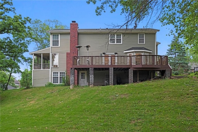 12343 Pinehurst Dr, Kansas City, KS 66109 - rear view of house featuring a chimney, a deck, and a yard