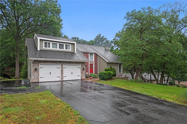 12343 Pinehurst Dr, Kansas City, KS 66109 - view of front of house with driveway, a garage, and a shingled roof