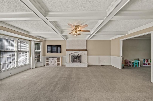 10601 Reeder St, Overland Park, KS 66214 - unfurnished living room featuring carpet floors, a textured ceiling, a brick fireplace, coffered ceiling, and ceiling fan