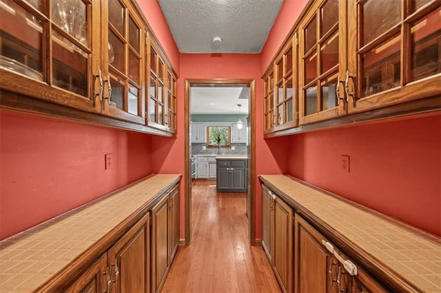 10601 Reeder St, Overland Park, KS 66214 - bar area featuring wood finished floors and a textured ceiling