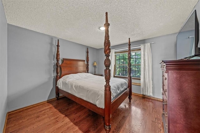 10601 Reeder St, Overland Park, KS 66214 - bedroom with a textured ceiling and wood finished floors