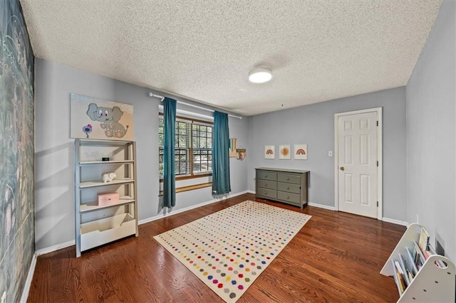 10601 Reeder St, Overland Park, KS 66214 - bedroom featuring wood finished floors and a textured ceiling