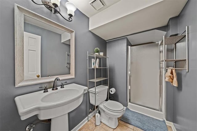 10601 Reeder St, Overland Park, KS 66214 - bathroom featuring a shower stall and tile patterned flooring