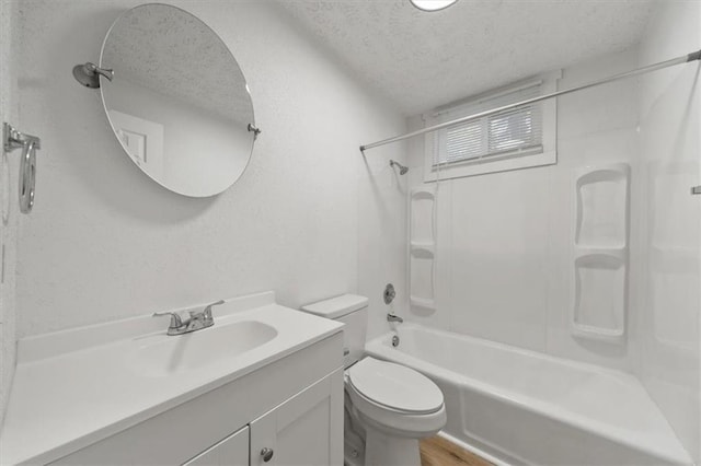 902 Twin Oaks Ter, Harrisonville, MO 64701 - bathroom featuring a textured ceiling, tub / shower combination, and vanity