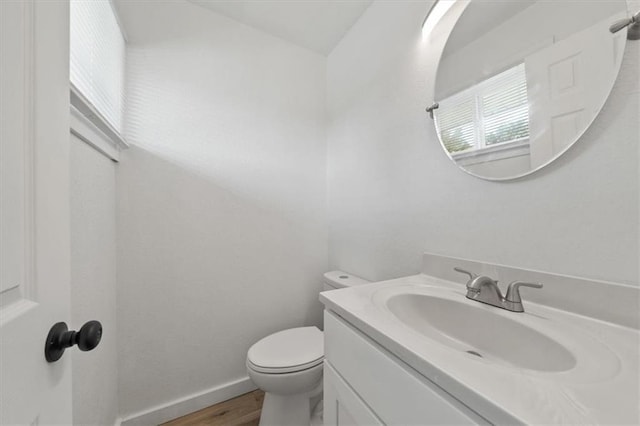 902 Twin Oaks Ter, Harrisonville, MO 64701 - half bathroom with vanity and wood finished floors