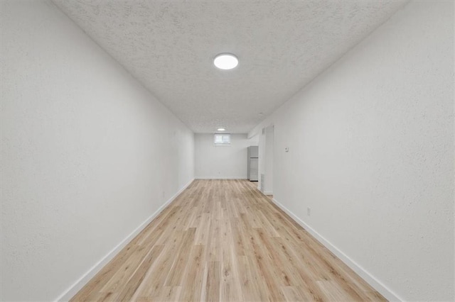 904 Twin Oaks Ter, Harrisonville, MO 64701 - hall with a textured ceiling and light wood finished floors