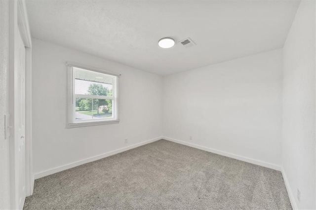 904 Twin Oaks Ter, Harrisonville, MO 64701 - unfurnished bedroom with carpet and baseboards