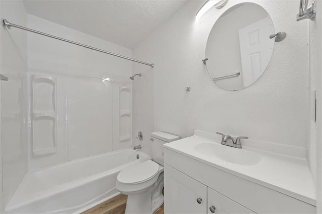 904 Twin Oaks Ter, Harrisonville, MO 64701 - full bath featuring bathtub / shower combination, vanity, wood finished floors, a textured wall, and a textured ceiling