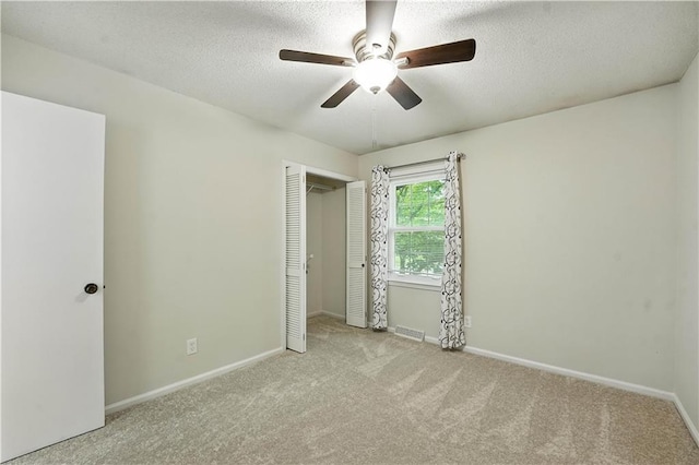 1303 SW Mission Pl, Lees Summit, MO 64081 - carpeted empty room featuring a ceiling fan and a textured ceiling