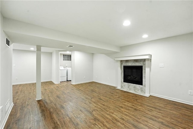 1303 SW Mission Pl, Lees Summit, MO 64081 - finished basement with independent washer and dryer, wood finished floors, a premium fireplace, and recessed lighting