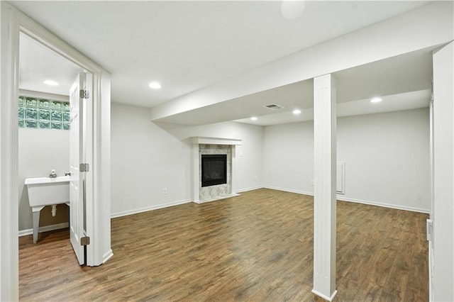 1303 SW Mission Pl, Lees Summit, MO 64081 - basement featuring wood finished floors, a premium fireplace, and recessed lighting