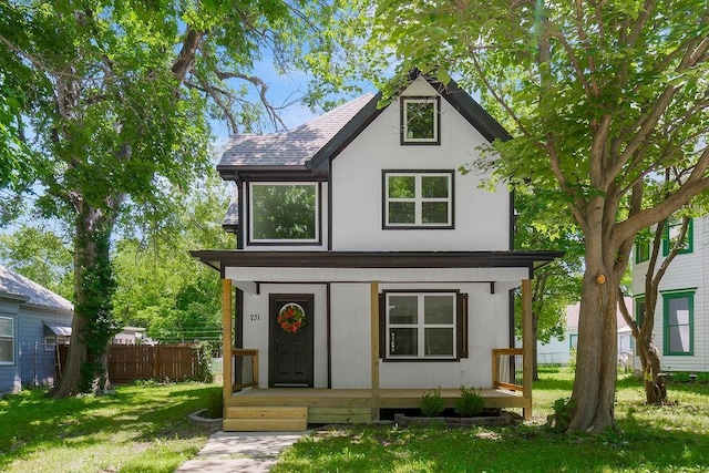 731 S Main St, Ottawa, KS 66067 - tudor home with covered porch and a shingled roof