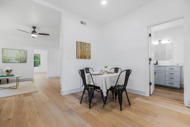 731 S Main St, Ottawa, KS 66067 - dining space with light wood-style floors and a ceiling fan