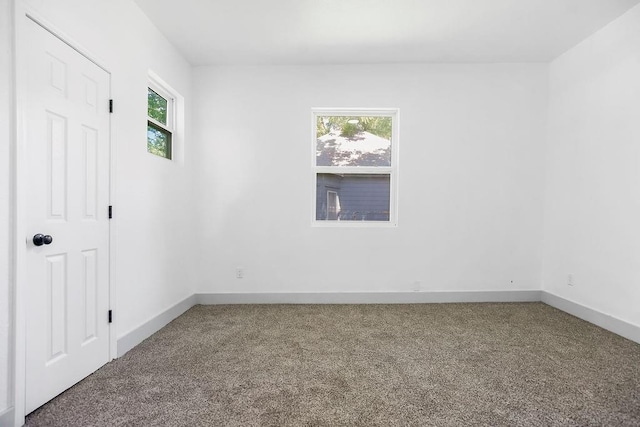 731 S Main St, Ottawa, KS 66067 - carpeted empty room with healthy amount of natural light