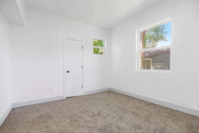 731 S Main St, Ottawa, KS 66067 - carpeted spare room featuring baseboards
