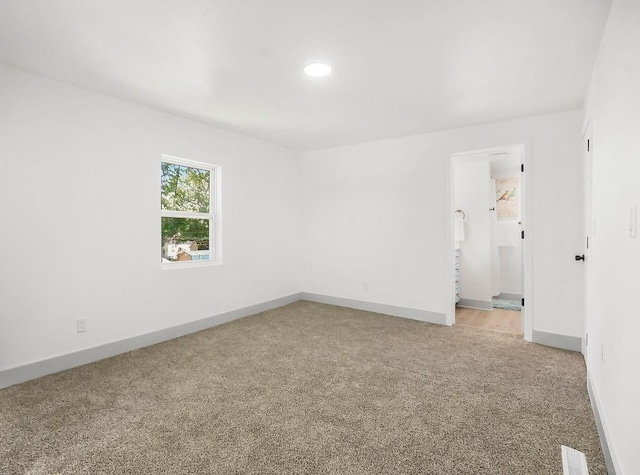 731 S Main St, Ottawa, KS 66067 - spare room with light colored carpet and recessed lighting