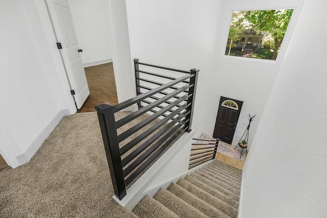 731 S Main St, Ottawa, KS 66067 - staircase featuring baseboards